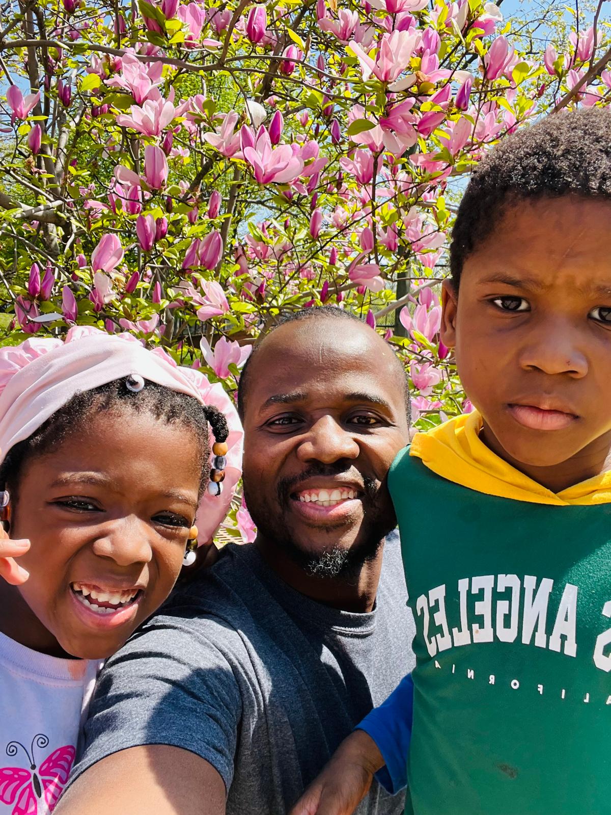 Hamza smiling with children